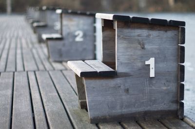 Close-up of wooden bench on table