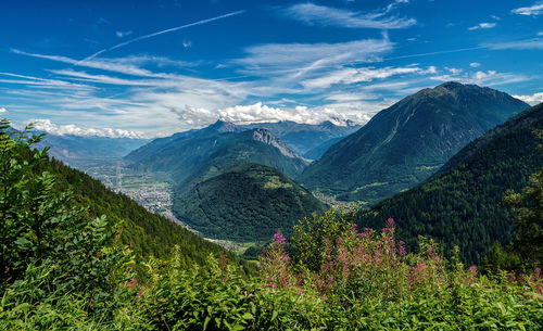 Scenic view of mountains against blue sky