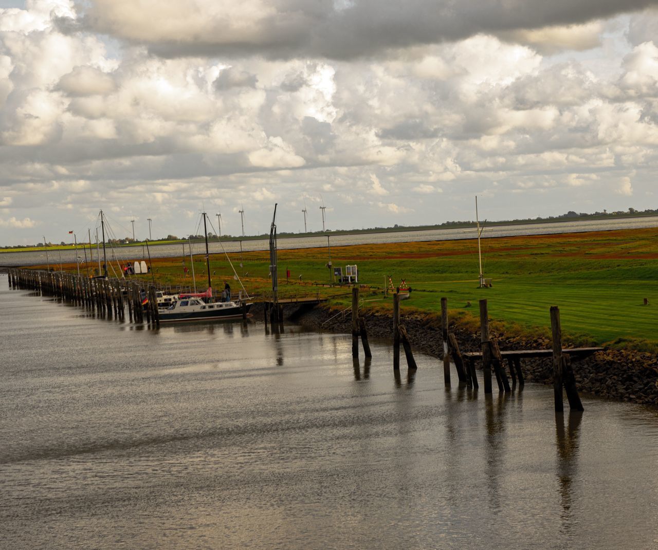 SCENIC VIEW OF LAND AND SEA AGAINST SKY