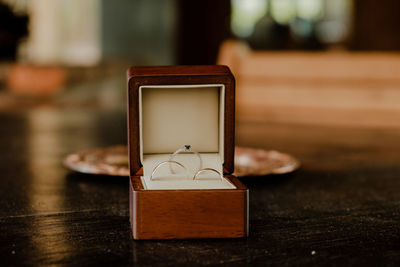 Close-up of woman using mobile phone on table