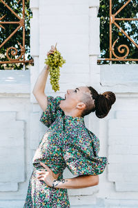 Portrait of young woman holding bouquet