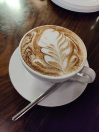 Close-up of cappuccino on table