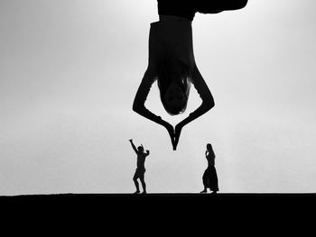 People dancing on stage against wall