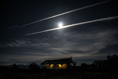 Silhouette built structure against sky at night