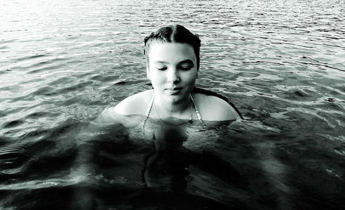 Portrait of young woman in swimming pool