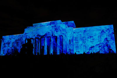 Low angle view of illuminated blue lights