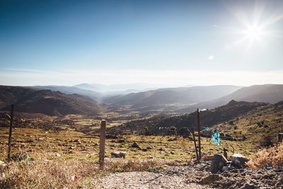 Scenic view of landscape against bright sky