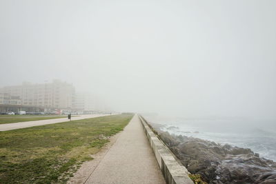 Scenic view of landscape against sky in city