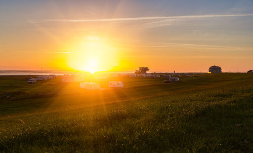 Scenic view of sunset over land