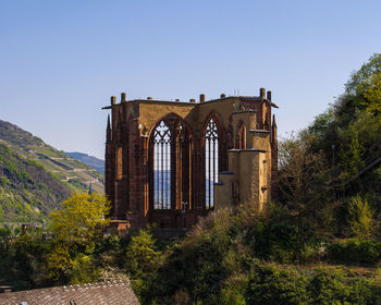 Exterior of historic building against clear sky