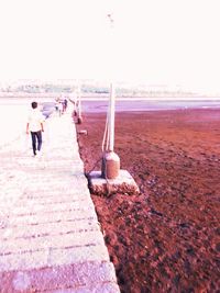 Full length of woman standing on shore