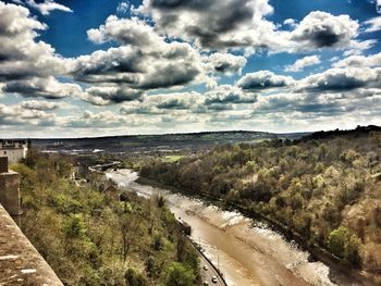 Scenic view of landscape against cloudy sky