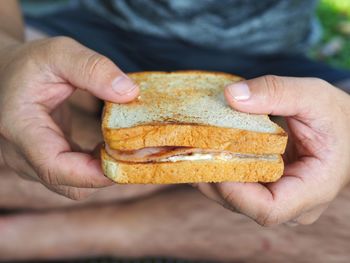 Close-up of hand holding bread