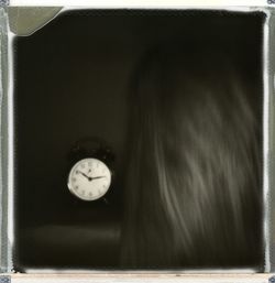 Close-up of clock on wall at home