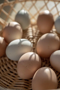 Basket of natural brown and bluish chicken eggs from local farmer's market