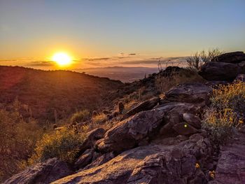 Scenic view of landscape against sky during sunset