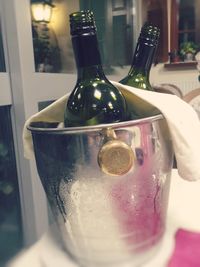 Close-up of wine bottles on table