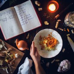 High angle view of person preparing food on table