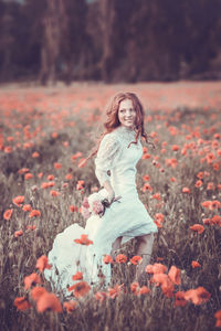 Portrait of smiling young woman on field