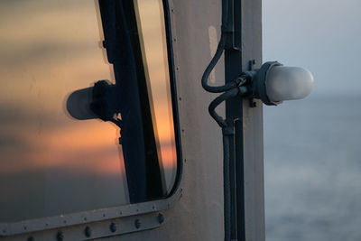 Close-up of metal against sky during sunset