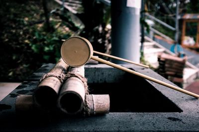 Close-up of wooden ladle on drinking water