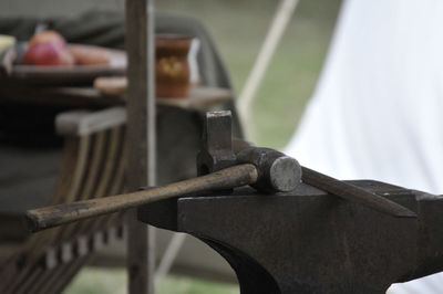 Close-up of hammer on rusty metal