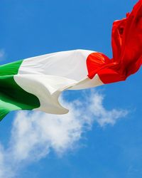 Low angle view of italian flag against sky