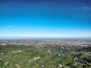 High angle shot of townscape against blue sky