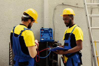 Rear view of engineer working at construction site