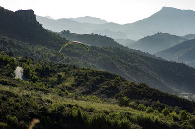 Scenic view of landscape and mountains against sky