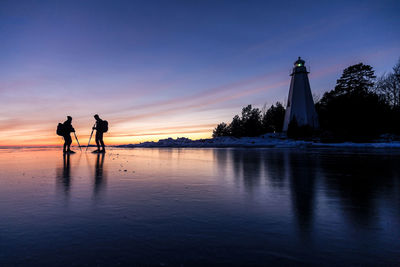 People long-distance skating at evening, vanern, sweden