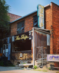 Graffiti on old building against sky