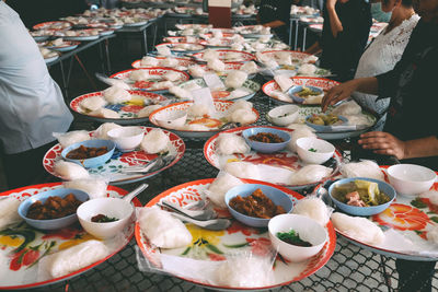 People sitting at restaurant with food on table