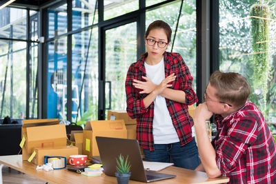 Colleagues discussing at creative office