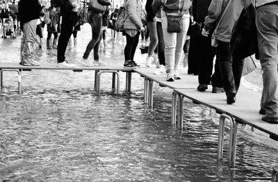 Low section of people walking on footpath