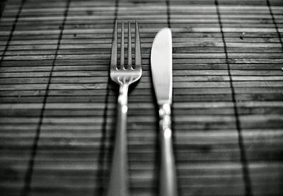 Close-up of fork and table knife on table