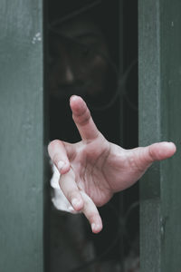 Woman behind fence