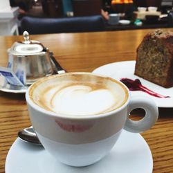 Close-up of coffee cup on table