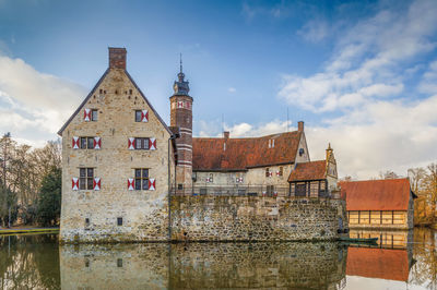 View of old building against cloudy sky