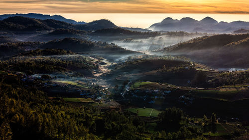 Scenic view of mountains against sky during sunset