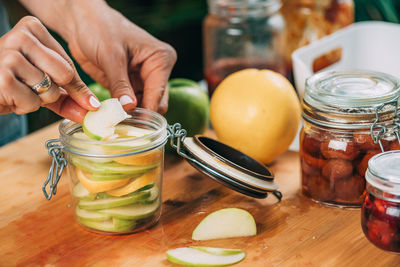 Fermentation food at home. woman preparing fruits for fermentation.