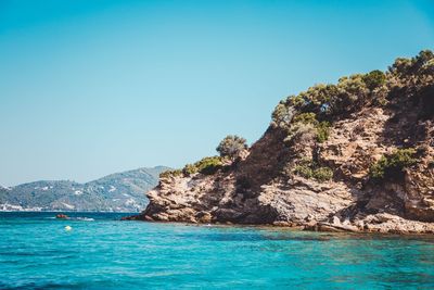 Scenic view of sea against clear blue sky