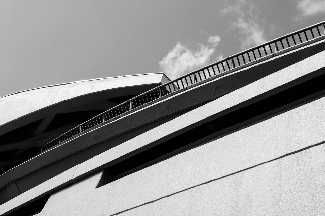 low angle view, built structure, architecture, railing, connection, bridge - man made structure, sky, steps, staircase, steps and staircases, engineering, bridge, day, building exterior, modern, outdoors, no people, metal, cloud, cloud - sky