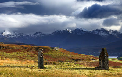 Scenic view of mountain against cloudy sky