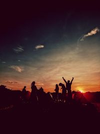 Group of people at sunset