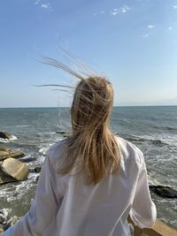 Rear view of woman in caspian sea in kazakhstan