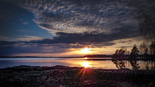 Scenic view of lake against sky during sunset