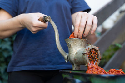 Midsection of man preparing food