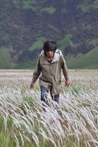 Full length of man standing on field