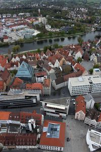 High angle view of houses in town against sky